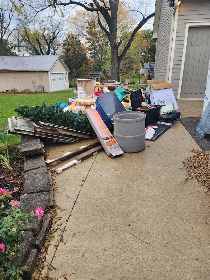 Dumpster being loaded with debris for 30 Yard Dumpster Rental in Greenwich
